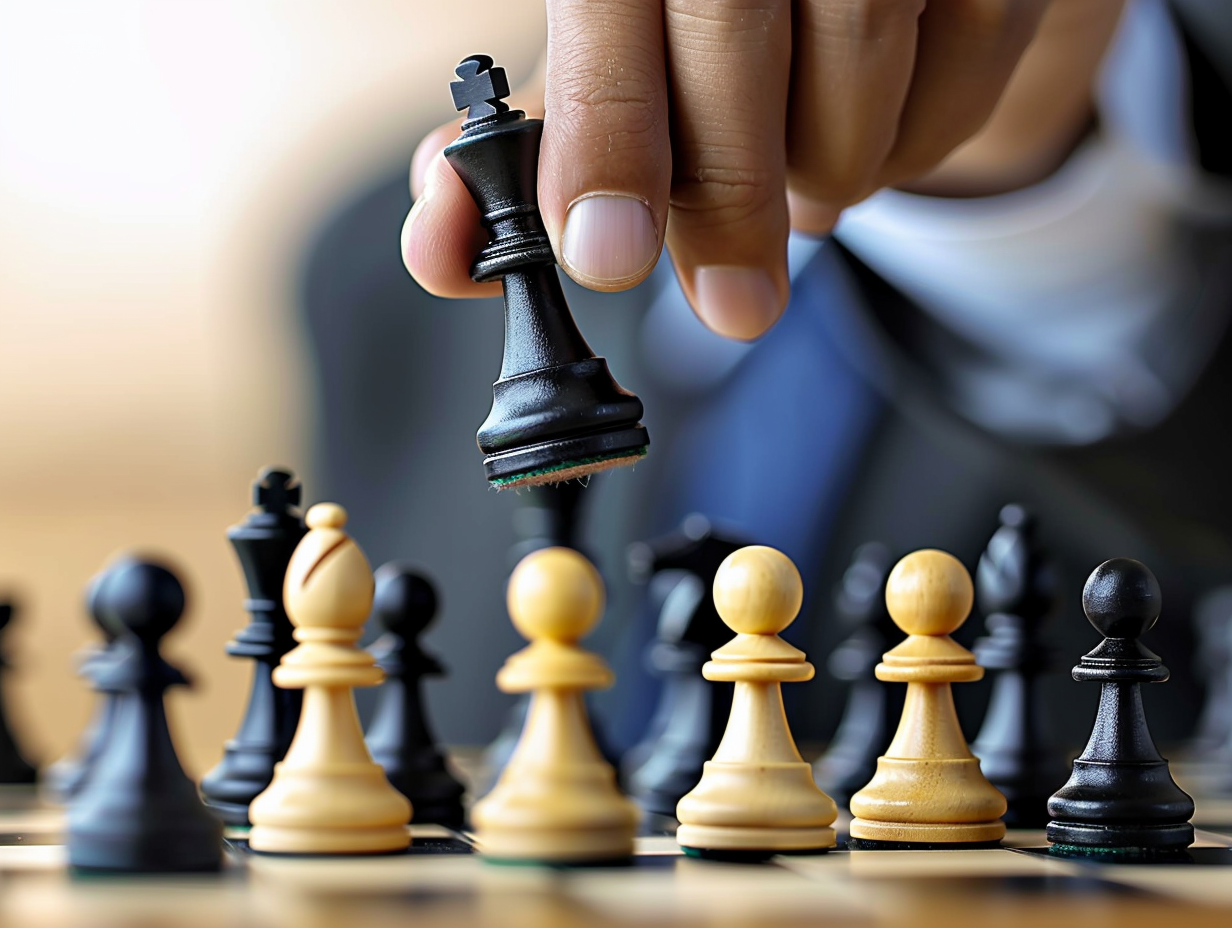 A man in a suit is playing chess with chess pieces - The Soulful Artists